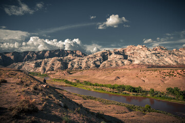 Plakat The beautiful view cloudy sky, red and green canyon with river in Colorado. The incredibly colorful background