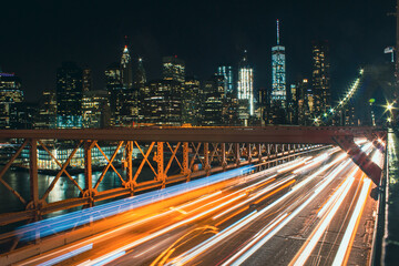 Night Lapse of cars passing over Brooklyn Bridge