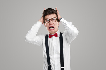 Annoyed funny geek in studio