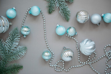 New year and Christmas tree decorations on grey background