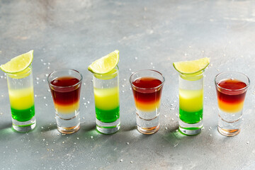 Variation of hard alcoholic shots. alcoholic cocktail drinks shot with lime