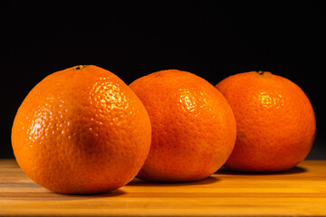 juicy sweet orange large on a black background
