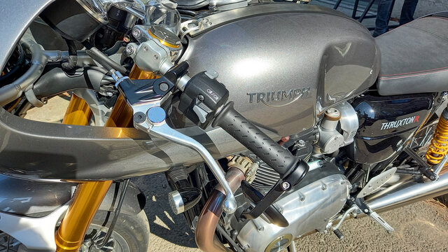 triumph thruxton neoretro Motorcycle brand logo and text sign on grey modern fuel tank of British motorbike manufacturer