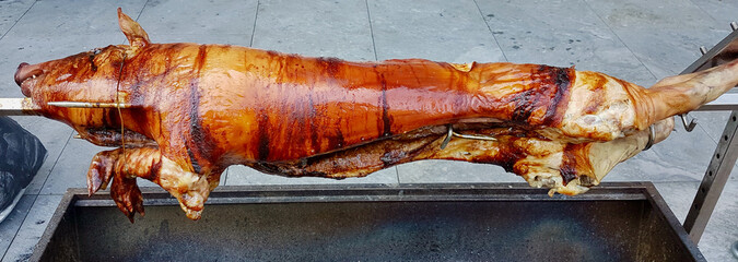 Suckling pig on a rotating spin. Close up.