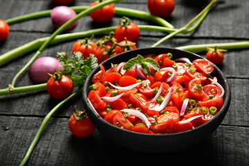 Homemade healthy diet meal, vegan foods background- organic red tomato , onion salad.