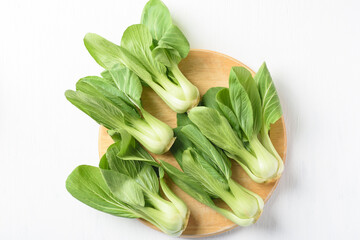 Bok choi (white cabbage) on a white background Ingredients in Asian Vegetarian and Healthy Food