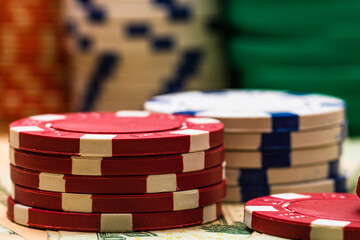Poker casino chips and money close up. Casino concept, risk, chance, good luck or gambling. Detail...