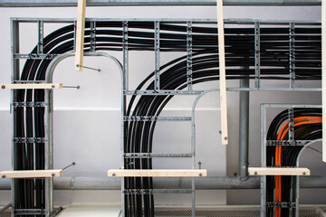 Electric power cables and instrument cables on the tray in electrical control room.