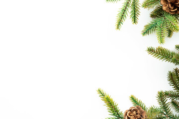Fototapeta na wymiar White table with Christmas decoration including pine branches and pine cones. Merry Christmas and happy new year concept. Top view with copy space, flat lay.