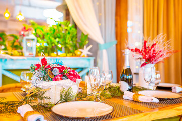 Christmas table. Festive table setting for New Year's dinner. Beautiful decoration in the restaurant awaiting guests.