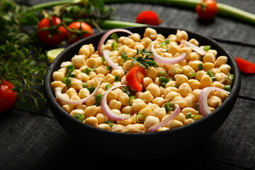 Healthy diet meal- vegan foods background- delicious organic chickpeas salad.