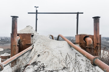 Old system of pipes on the barrel. White fertilizers or sand pipeline filtration of chemical and...