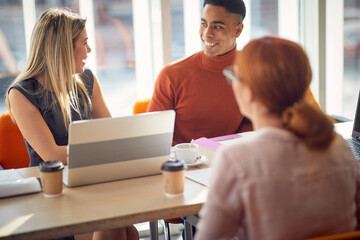 Young colleagues are chatting during an interview for a new job position. Business, people, company