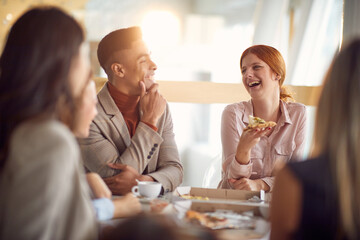 Group of young business people is having a good time during a lunch break at the job. Business,...