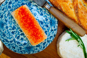 French cheese and fresh  baguette on a wood cutter