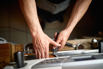 A bird-eye view on barman's hands preparing an espresso. Coffee, beverage, bar