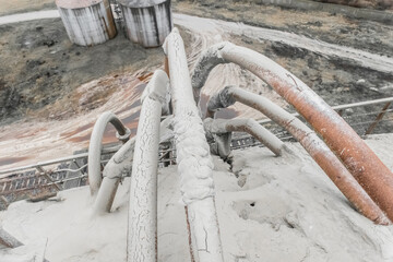 Old system of pipes on the barrel. White fertilizers or sand pipeline filtration of chemical and...