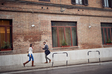 Fototapeta na wymiar Pedestrians on the sidewalk in the city. Walk, city, street