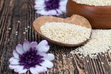 white sesame seeds on a wooden table