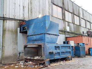 Exterior wall of an industrial workshop with pressing equipment