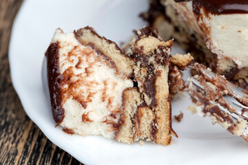 chocolate cream cake covered with milk chocolate