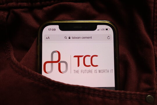KONSKIE, POLAND - September 15, 2021: Taiwan Cement Corporation logo on mobile phone hidden in jeans pocket