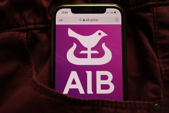 KONSKIE, POLAND - September 15, 2021: Allied Irish Banks plc logo on mobile phone hidden in jeans pocket