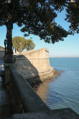 Cadiz Andalusia Spain old town historic fort city wall promenade botanic garden house facades...
