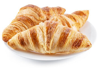Tasty crusty croissants on the plate on white background.