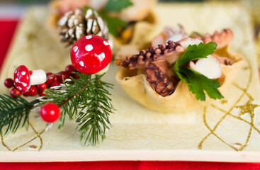 seafood appetizer inside bread basket on Christmas table