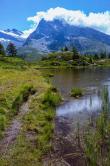 Naklejka na ściany i meble The meadows, glaciers, lakes and mountains of the Simplon Pass: one of the most beautiful areas of Switzerland located in the heart of the Alps - July 2021.