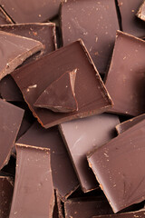 a chocolate bar broken into more pieces
