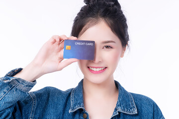 Surprise smile Asian woman using credit card cover eye presenting transaction money for shopping online over isolated white background. Satisfaction payment finance concept.