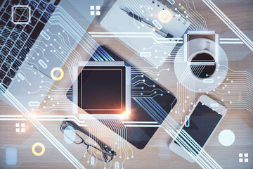 Double exposure of technology theme drawing over work table desktop. Top view. Global data analysis concept.