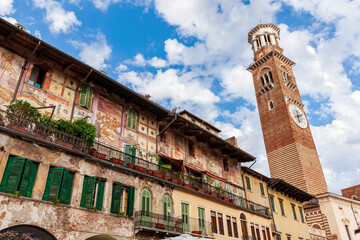 Piazza delle Erbe, view of the historic facades and Torre dei Lamberti. Verona, Italy