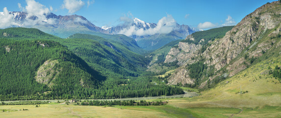 Picturesque mountain valley on a sunny summer morning, panoramic view