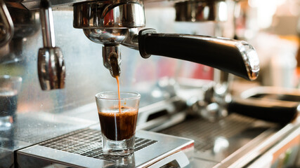 black coffee with milk on a coffee maker