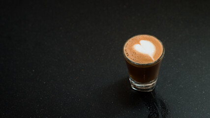 latte coffee served on wooden table at cafe​