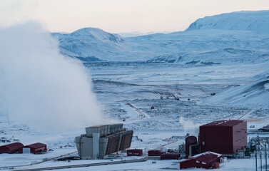 Geothermic plant with with smoke and snow in Iceland