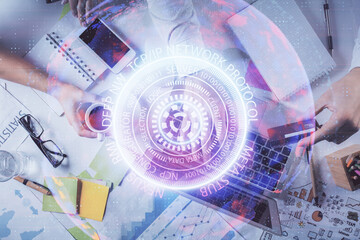 Double exposure of man's hands typing over computer keyboard and tech theme hologram drawing. Top view. Technology concept.