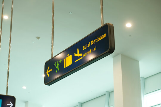 Selective focus with noise effect picture of arrival hall sign in the airport.