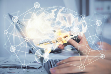 Multi exposure of woman hands working on computer and brain hologram drawing. Ai concept.