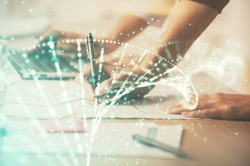 Double exposure of woman hands typing on computer and DNA hologram drawing. Medical education concept.