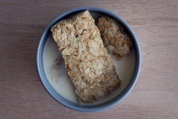 Weet Bix is a whole grain wheat healthy cereal. High protein and healthy breakfast in a bowl created and manufactured in Australia and New Zealand by the Sanitarium Health Food Company