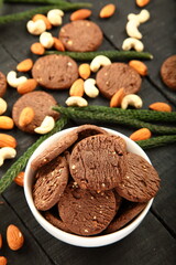 Bowl of fresh baked dry fruits, cashew nuts, almonds cookies.