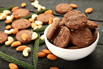 Bowl of fresh baked dry fruits, cashew nuts, almonds cookies.