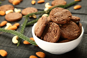 Bowl of oven fresh cashew nuts almonds cookies biscuits.
