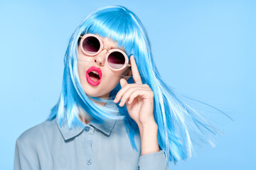 cheerful woman wearing sunglasses blue wig glamor model