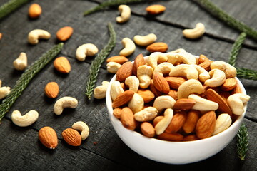 Bowl of delicious and healthy appetizer snack food , cashew nuts , almonds. 
