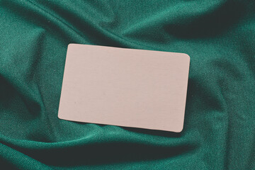 a blank card isolated on a green cloth
